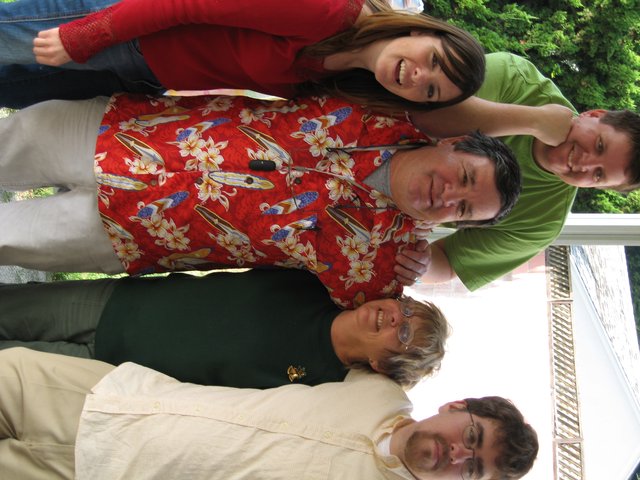 Five Family Members Celebrate Christmas Together Indoors