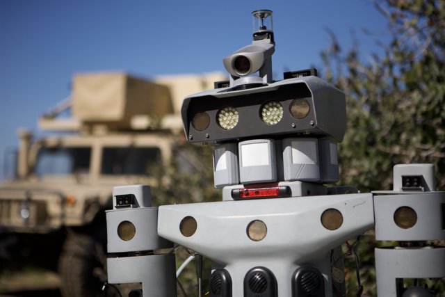 Robot guarding military vehicle