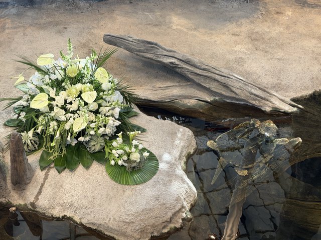 Memorial Flower Arrangement by Tranquil Water Feature