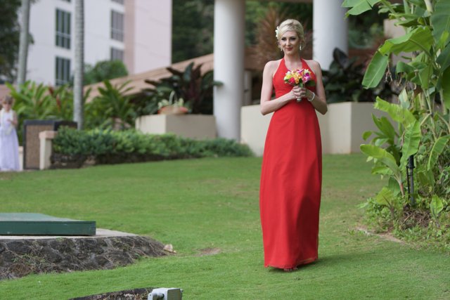 A Lady in Red Graces the Lawn