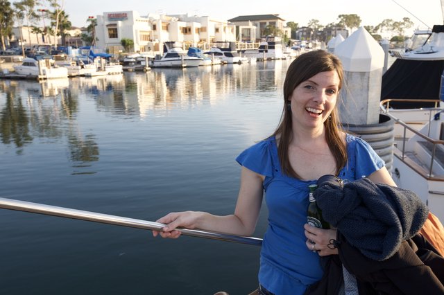 Woman Smiling at a California Marina at Sunset