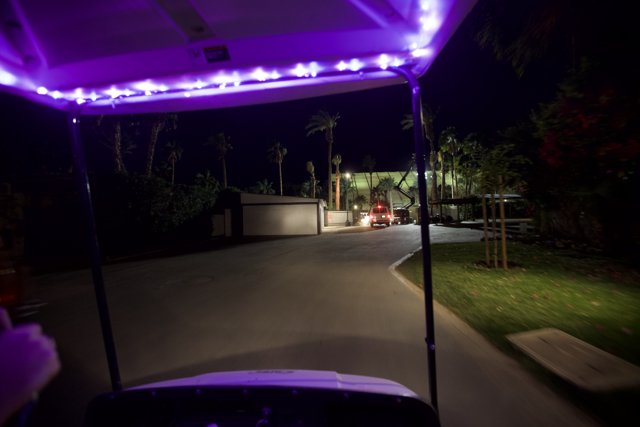 Purple-Lit Golf Cart on Tarmac