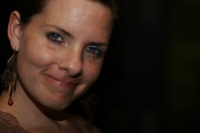 Penelope's Coy Smile in Dramatic Low Light