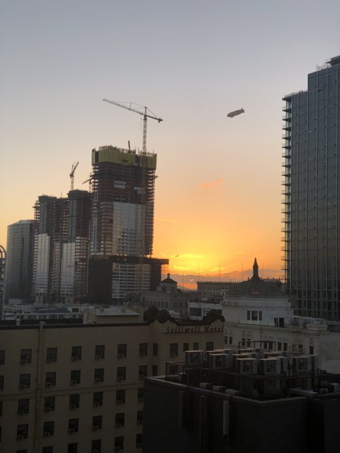City Sunset with Construction Cranes