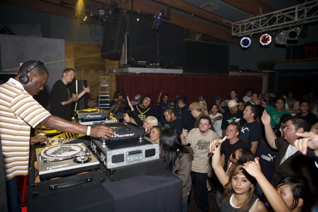 Party-goers groove to the beats of DJ Kenny Ken
