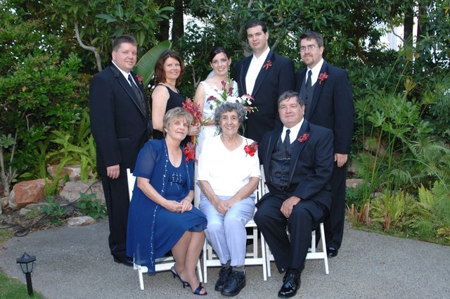 Family Portrait at Outdoor Garden Wedding Celebration