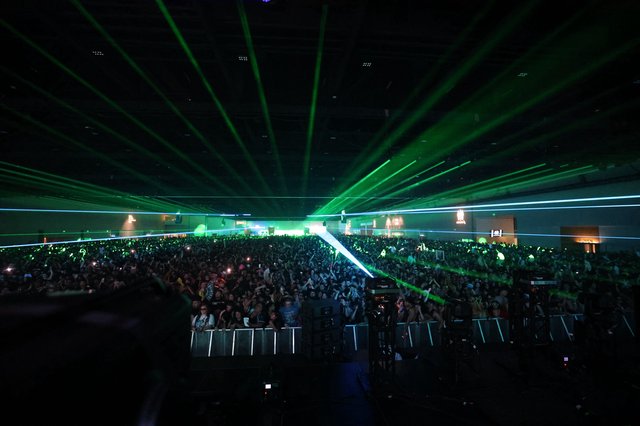 Green Laser Light Show Over Massive Festival Crowd