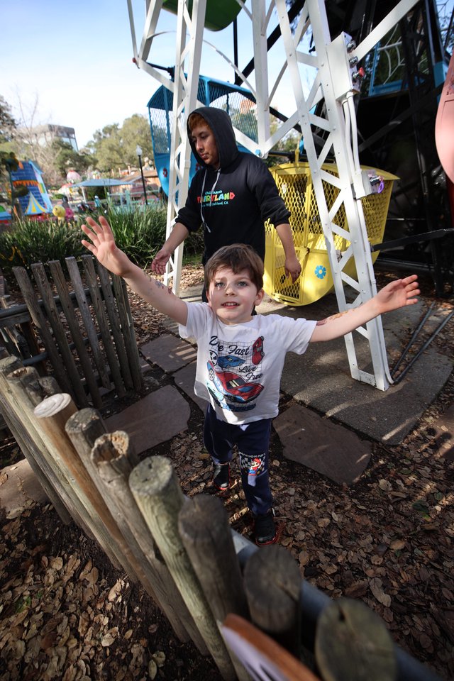 Young Boy's Joyful Moment at Theme Park Playground
