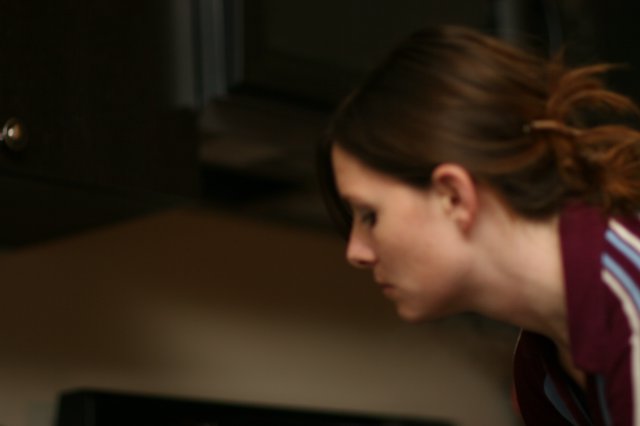 Young Woman in Focused Concentration, Side Profile
