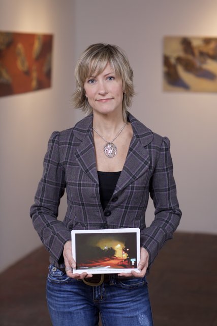 Woman Engages with Art on Tablet