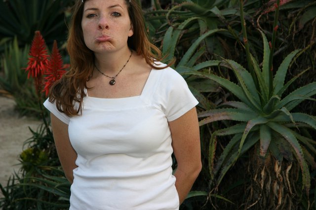 Young Woman Making Pouty Face in Desert Garden