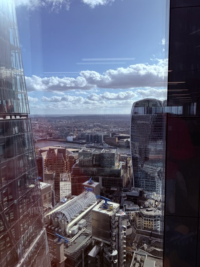 Aerial View of London's Financial District Under Dramatic Skies