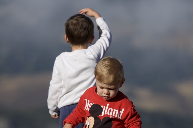 Two Young Boys Against a Stormy Sky