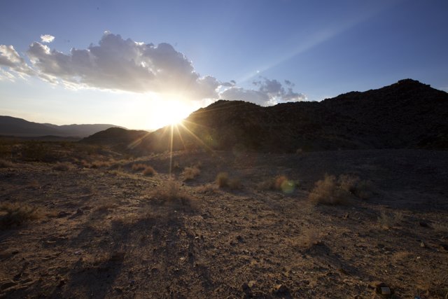 Desert Sunset with Mountain Flare