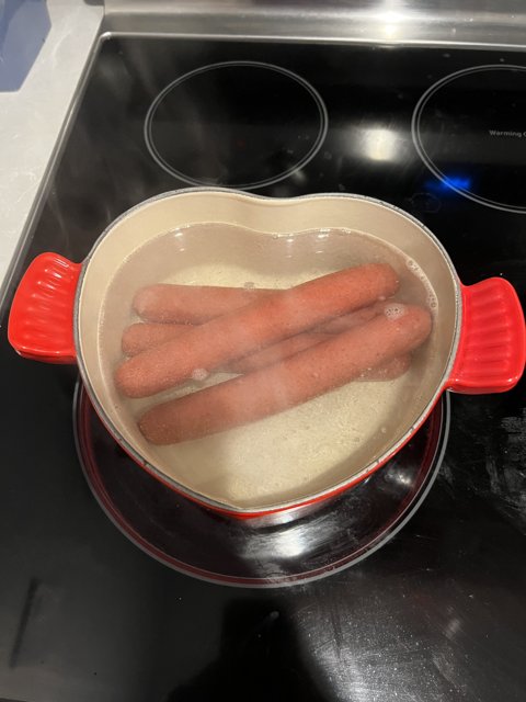 Hot Dogs Boiling in the Cooking Pot
