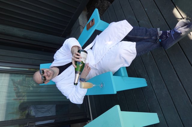 Relaxing with Champagne in White Bathrobe