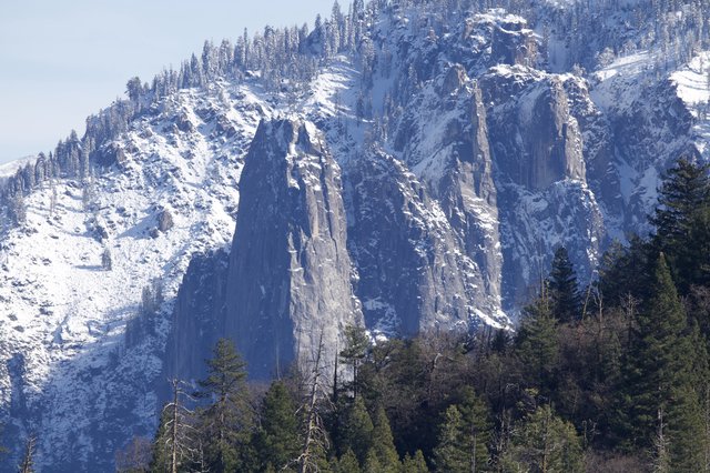Winter's Majesty: Snow-Covered Granite Cliffs in Yosemite