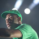 Tyler, The Creator rocks a green cap on stage