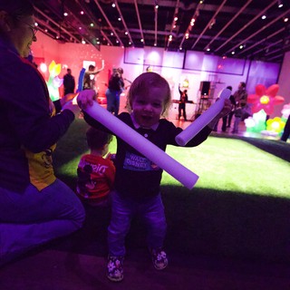 Child with Glow Sticks at Baby Rave Event