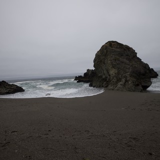 Solitary Sea Stack on Fog-Shrouded California Coast