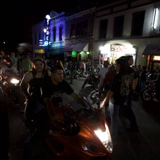 Motorcycles Cruise Through Austin at Night