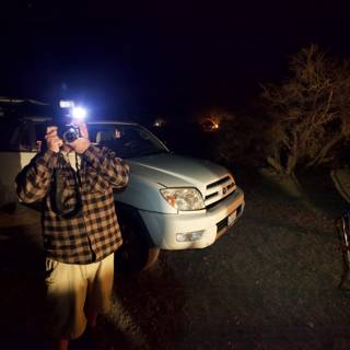 Nighttime Photography of a Man and His Truck