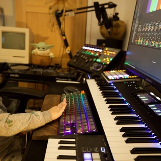 Young Child Explores Music Production Studio Setup