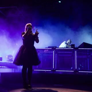 Woman in a Dress Takes the Stage with a DJ at Coachella Concert