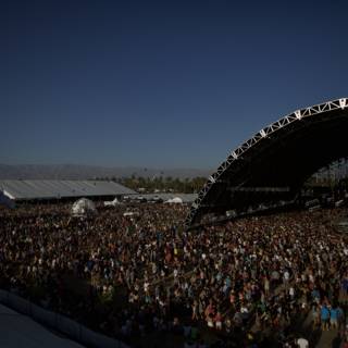 Concert Crowd Under the Blue Sky