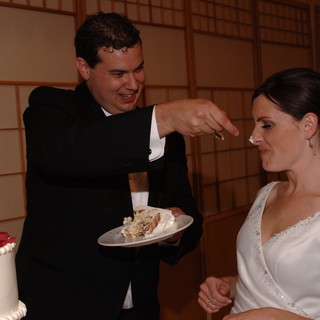 Groom Smears Wedding Cake on Bride's Nose