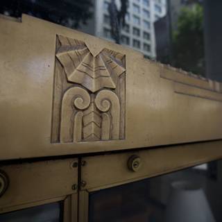 The Intricate Wooden Emblem on the Golden Monastery Door