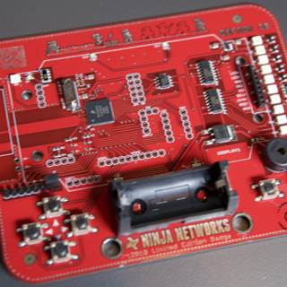 Red Circuit Board with Electronic Device