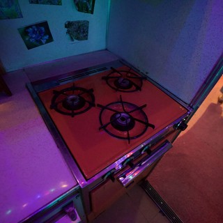 Gas Stove Installation Under Colored Gallery Lighting
