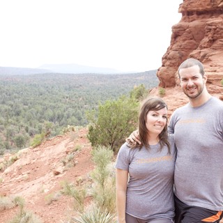 Couple Smiling Atop Sedona Red Rock Overlook