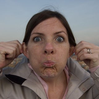 Woman Making a Silly Face on Urban Rooftop