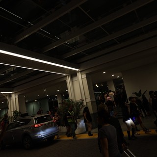 Festival Crowd Gathers Outside Venue at Night