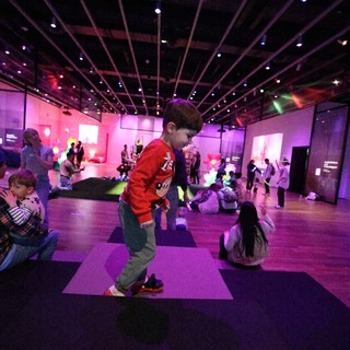 Child Dancing at Baby Rave Interactive Light Installation