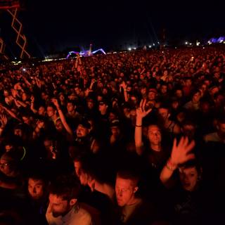 Cochella Concertgoers Reach for the Night Sky
