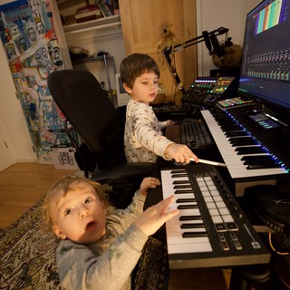 Young Brothers Making Music Together in Home Studio