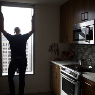 Man Embraces His Kitchen
