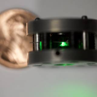 Green Laser Next to a Penny