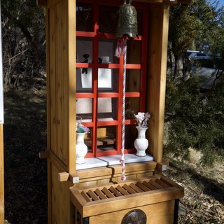 Traditional Japanese Shinto Shrine with Bell and Offerings
