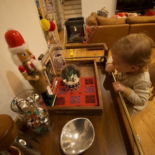 Child Admiring Christmas Decorations at Home