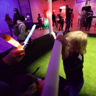 Child with Glow Stick at Baby Rave Event