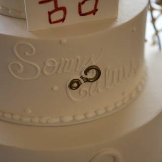 Elegant White Wedding Cake with Red and White Design