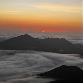 Summit Sunrise: Above the Clouds