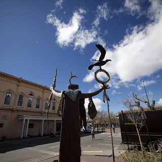 Indigenous Spirit Sculpture Against Santa Fe Sky