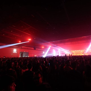 Massive Indoor Rave Ignites Under Red Light Beams