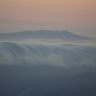 Fog Cascades Over the Hills at Twilight