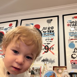 Curious Toddler with Blonde Hair at Home